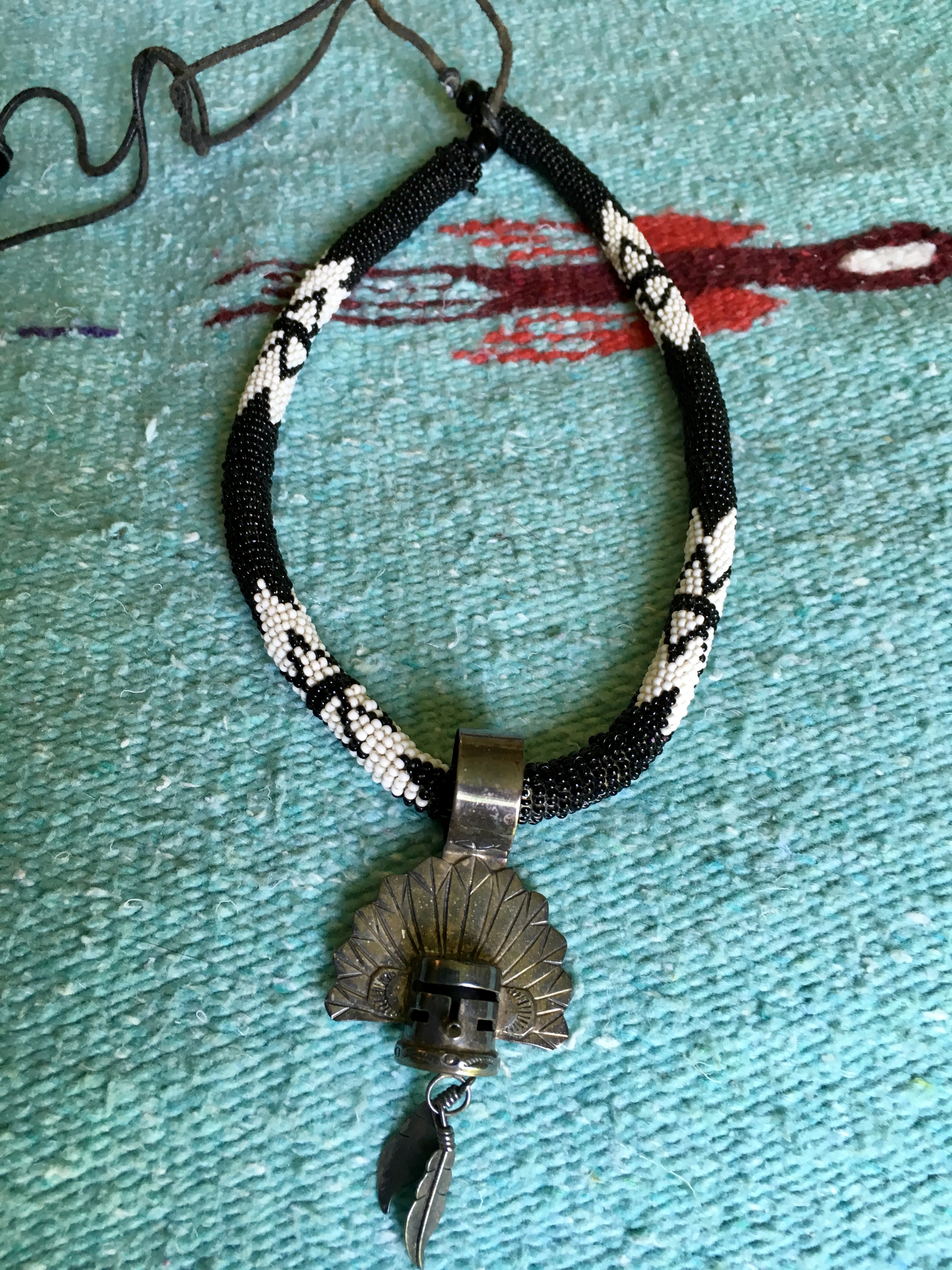 Beaded necklace with leather ties and a sterling Kachina pendant ...