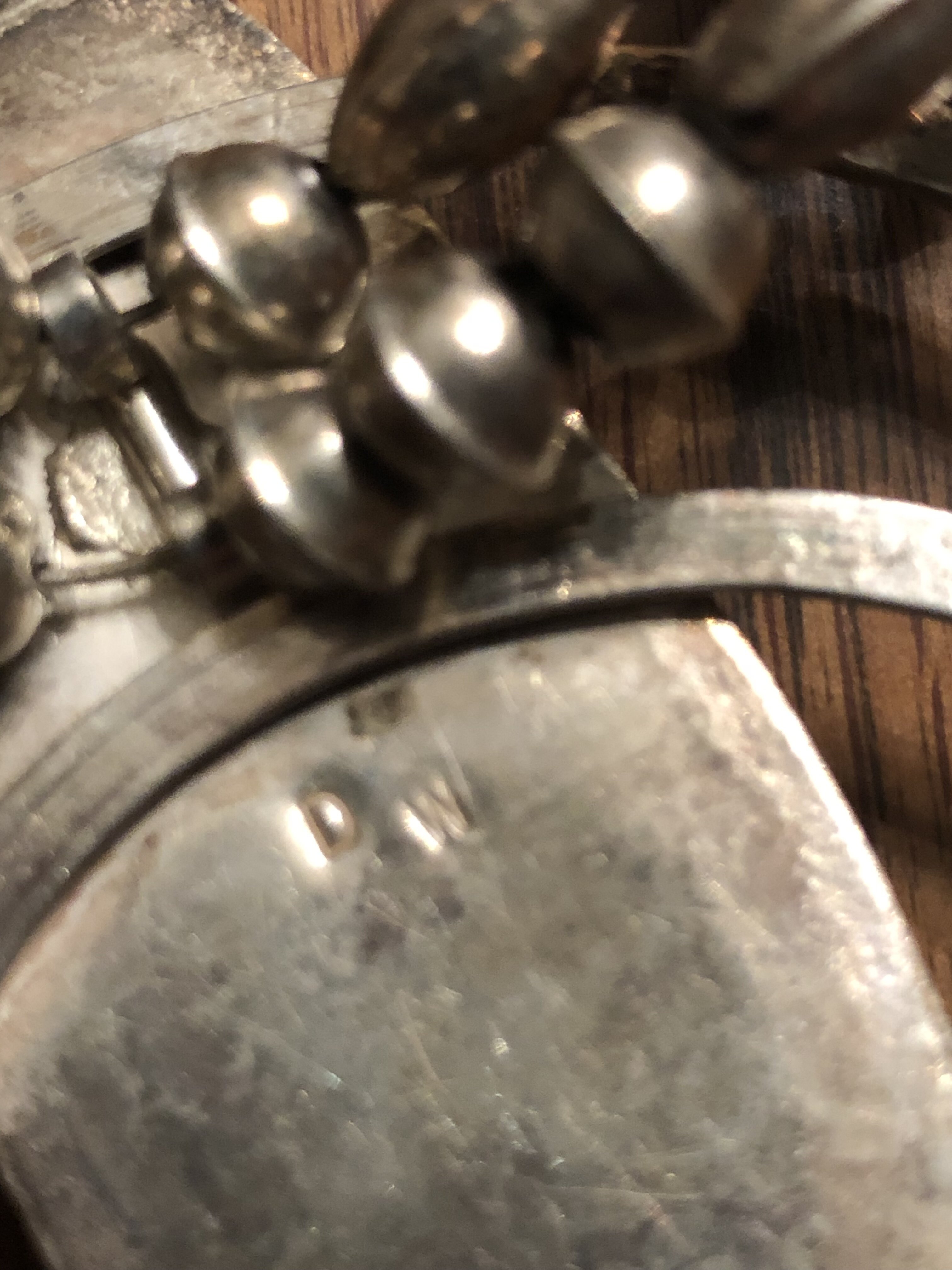 Please help identify hallmark D W on squash blossom from 1970’s